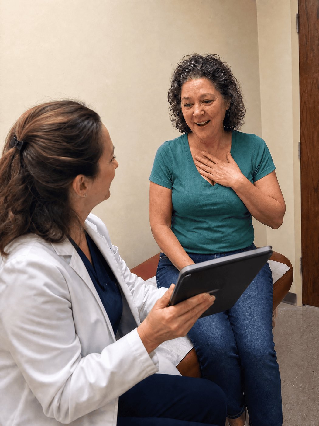 A warm exam room. A female doctor (~45, white coat, kind face) sitting and showing a tablet chart to a patient — a slimmer, healthier-looking woman of ~54 in normal clothes, smiling in disbelief with a hand on her chest. Bright, clean, hopeful lighting.